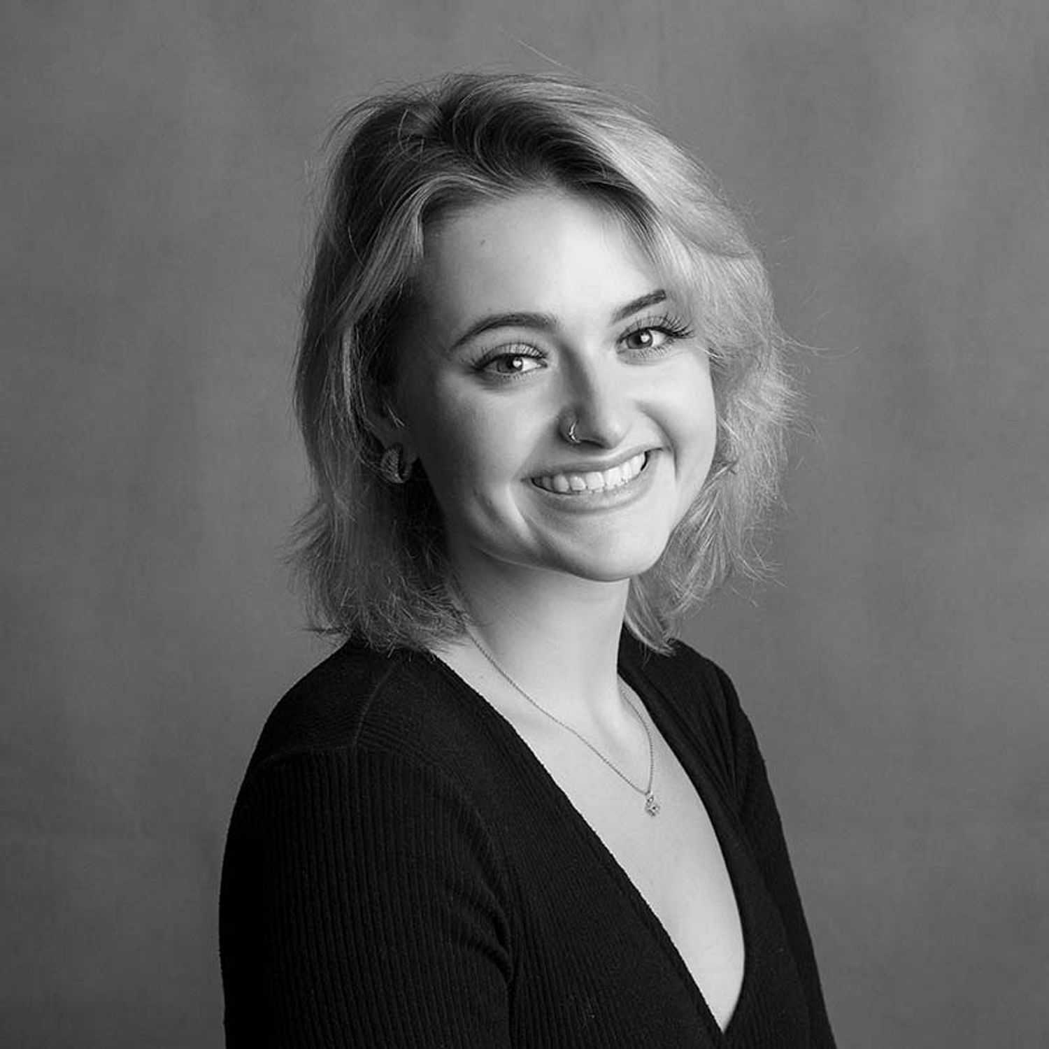 Portrait of Melissa, a professional stylist at Joe's Salon, showcasing their expertise and style.